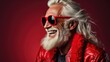 © andrenascimento - Modern Santa Claus in sunglasses. Full body view of Santa Claus on solid color background with copy space. Current Santa Claus.