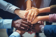 © Surachetsh - A close up top view shot of multinational business people joining hands together, teamwork build up concept. Generative AI.