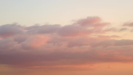 Wall Mural - The beauty of nature is enhanced by the cloudy sunset sky, time lapse.