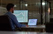 © insta_photos - Business man trader broker analyst investor using computer analyzing stock trade crypto market investing finances working in dark night office. Copy space for learning stock trading course ads.
