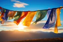 Tibetan Prayer Flags Fluttering In The Wind, Symbolizing Peace, Compassion, And Spiritual Well-being.