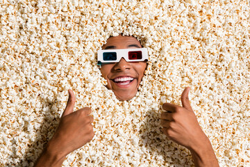 Canvas Print - Photo of excited positive guy full popcorn enjoy cinema make thumb up symbol review movie isolated background