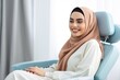 arab woman smiling happily while sitting in medical chair at dental clinic. AI Generated