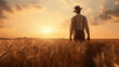 young 1920s american farmer gazing into the sunset over a wheat field