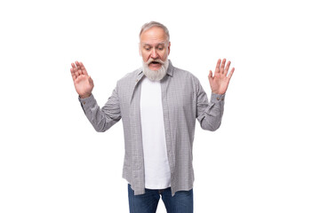 Wall Mural - a cute grandfather with a white beard and mustache is wearing a striped shirt over a t-shirt