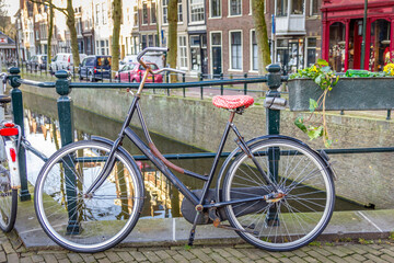 Sticker - Bicycles in a canal in Gouda, The Netherlands