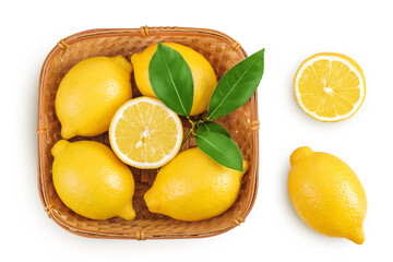 Wall Mural - Ripe lemons in wicker basket isolated on white background. Top view. Flat lay.