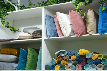 Leinwandbilder - Shelves in a store with colorful pillows and towels