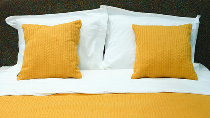Poster - Interior of a modern bedroom in an apartment, hotel or private house with a bed and pillows