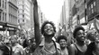 immigrant families and minority people on a protest march for civil rights minority or womans rights social justice and equality. Black and white image, focused on the young girl in front leading the 