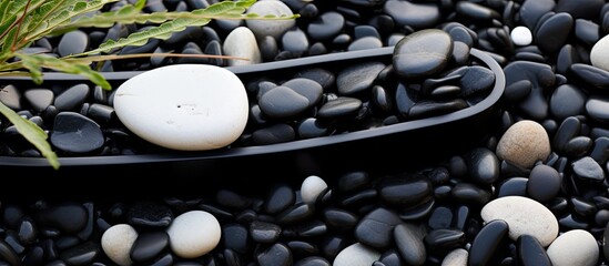 Sticker - In the midst of the serene garden, an abstract, texture-rich design emerged, blending the black stone with the natural shapes and colors of the surrounding scenery, creating a striking contrast