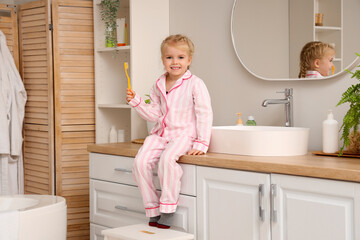 Sticker - Cute little girl with toothbrush in bathroom