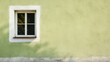 © Olga - a window on the side of a green wall with a tree in the window and a shadow of a tree in the window.