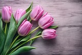Fototapeta  - Captivating Charm: Pink Tulips Blooming against Rustic Wooden Backdrop Generative AI