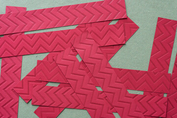 Sticker - red paper stripes with embossed chevron or zig zag pattern 