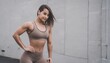 Bodybuilder woman, muscular womans torso wearing sportswear in the gym. copy space, fit person, professional model, fashion photo. Generative AI