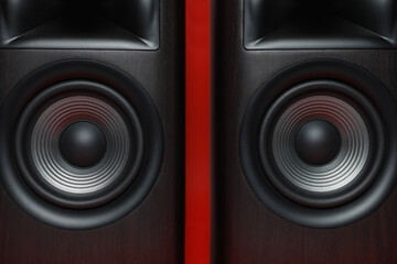 Wall Mural - Modern wooden sound speakers on red background, closeup