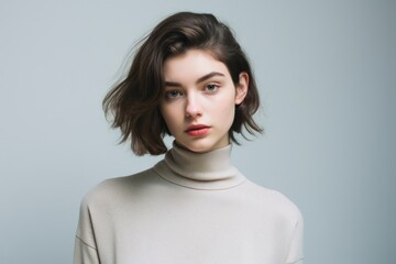 Wall Mural - a woman with short brown hair wearing a turtleneck