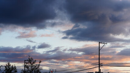 Wall Mural - the beautiful sunset view with the colorful clouds and warm sunlight