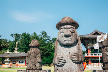 Wall Mural - Yakcheonsa Temple and Dol hareubang in Jeju Island, Korea