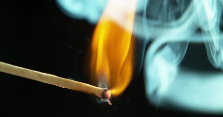 Wall Mural - match, fire and heat on a dark background in studio closeup to light a flame during a blackout. nigh