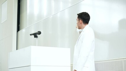 Aufkleber - Male lecturer giving a lecture in the auditorium. University professor. Science student.
