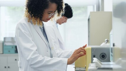 Poster - Group of researcher using experimental equipment.