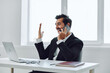Office man talk phone computer laptop businessman winner smile sitting professional happy