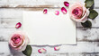 Blank note paper on a wooden background with roses for your valentine love celebration message greeting 