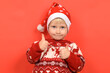 © stanisluva - funny portrait of a boy, a child in a Santa Claus hat, Christmas