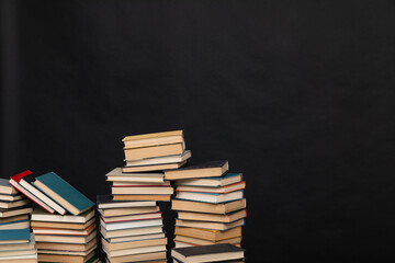 Wall Mural - Many stacks of educational books to study in the university library on a background