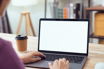 Fototapete - Woman hand type on the keyboard on laptop with mockup of blank screen for the application.