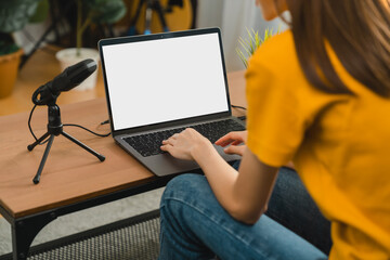 Fototapete - Woman hand type on the keyboard on laptop with mockup of blank screen for the application.