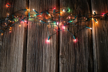 Canvas Print - red Christmas lights on wooden table