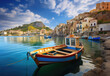 © Kien - colorful houses and boats on the harbor