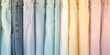 Close-up of fashion details of trendy jeans in pastel delicate color. Texture of denim fabric, fragment of fashionable pants of pastel blue color.