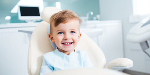 Сute smiling child sits in a modern dentist chair of kids dentistry clinic. Dentist for children, modern dental clinic office.