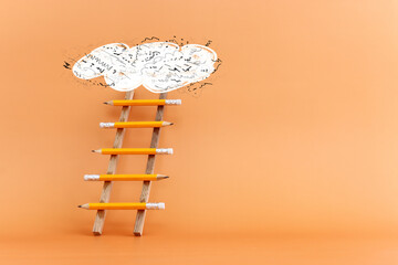 Wall Mural - Concept image of a ladder made of pencils. Idea of education, success and achieving goals