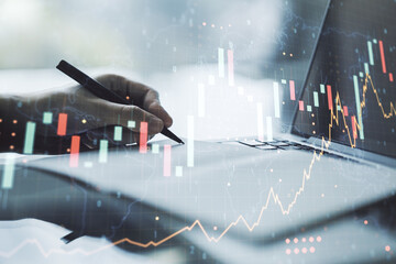 Aufkleber - Multi exposure of abstract creative financial graph with world map and with hand writing in notebook on background with laptop, forex and investment concept