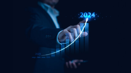 2024 Business growth, target and goal plan, New year business strategy and challenge. Development to success. Economic indicators. Businessman drawing line for increasing arrow from 2023 to 2024.