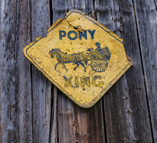 Pony Buggy Crossing : Antique Sign On Old Barn 
