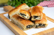 Handmade Spinach Cheese Pie - pastry, Turkish name; el acmasi borek, rulo borek. Turkish borek rolls with spinach and cheese. A traditional Turkish pastry rulo borek