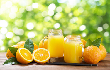 Canvas Print - Jar glasses of fresh orange juice with fresh fruits