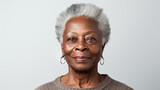 Fototapeta  - Close-up portrait of mature old black woman with short haircut isolated on white background, african-american lady with gray hair smiling. Copy space. AI generated 