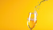 closeup of glas of champagne on yellow background