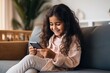 © RamvijayB - Tech-Savvy Delight: Joyful Indian Girl Enjoying E-commerce on Sofa generative ai