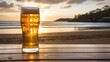 Glass of beer on the beach at sunset with copy space for text. Australia beer concept.