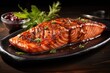 Succulent grilled salmon fillet with herbs and a balsamic glaze on a dark plate