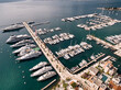 Yachts are moored in rows along the marina several piers. Porto, Montenegro. Top view