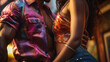 © Studio Light & Shade - Seductive Latin American couple in colorful clothes dancing salsa in a club. Beautiful young people feeling attracted to each other, having fun at a social dance party. Romance, passion.